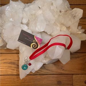 Necklace-wire wrapped turquoise stone mounted on silver wheel,red heart